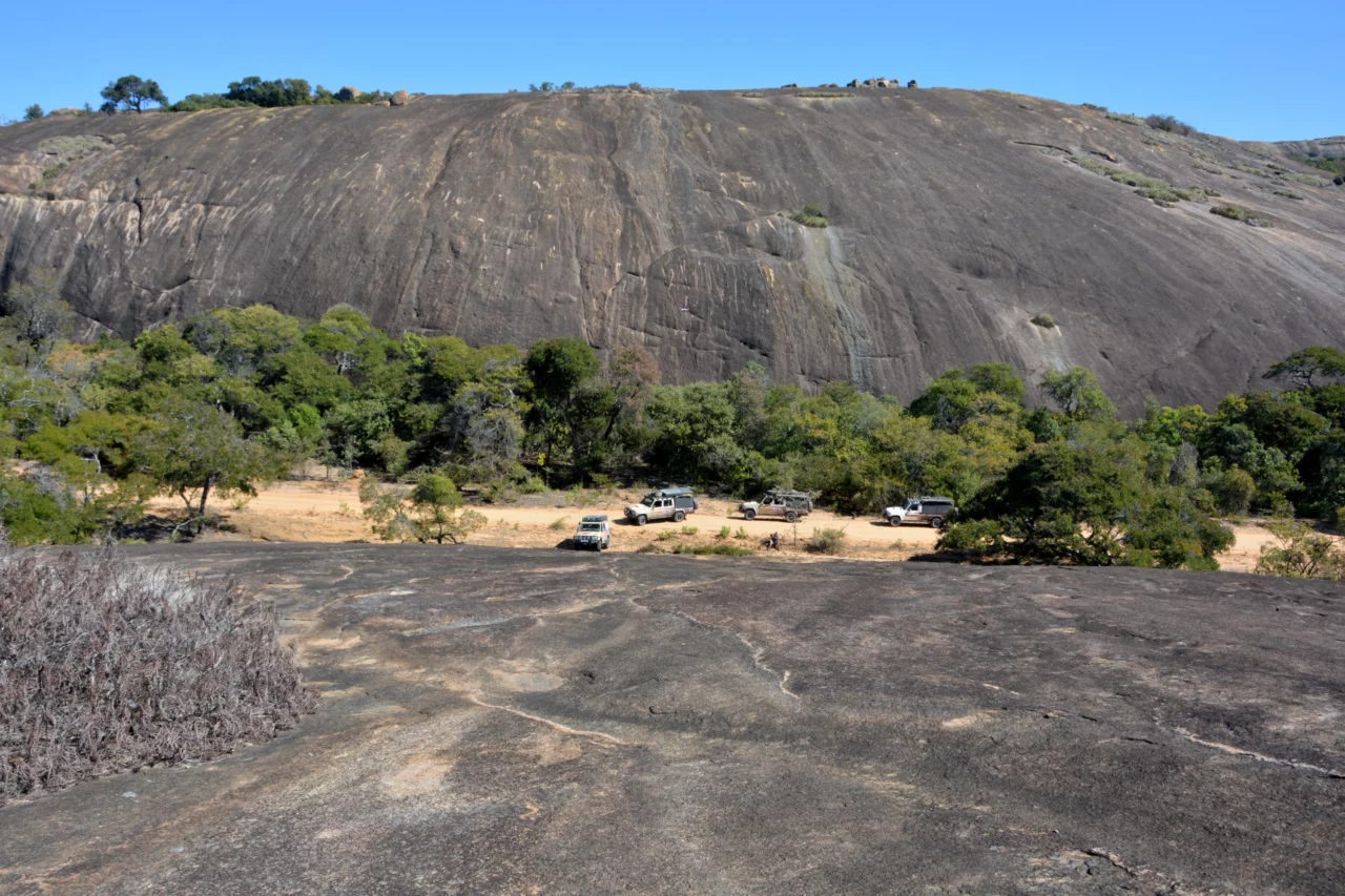 Voetsporerentals Campers driving through a massive rock valley mid day during the trip through Matabeleland. 